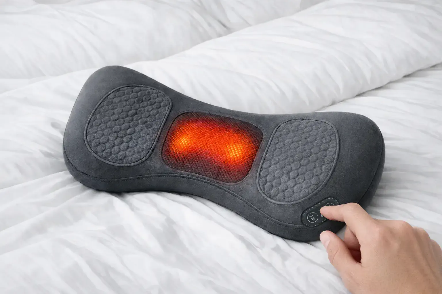 Hands adjusting ReliefMD controls while device supports lumbar area